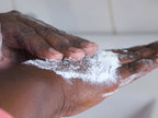 Be You Skincare Exfoliating Rice Scrub on African lady's hands